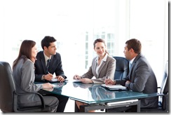 Businessmen and businesswomen talking during a meeting